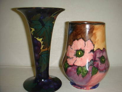 Two Art Pottery Vases:: Two Art Pottery Vases: Royal Stanley Ware Jacobean Redware Trumpet Vase with Grape Motif is 6"T. CA 1930's. H&K Tunstall England Vase with Peonies is 5"T. Moorcroft Style. (200-300)