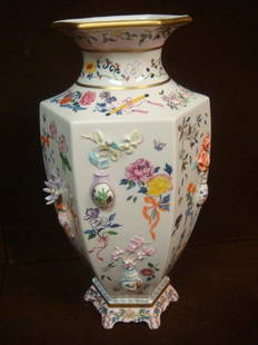 Franklin Mint Vase of "One Hand Flowers";: Franklin Mint Vase of "One Hand Flowers"; Designed by Dawen Wang. 12"T Hexagonal Vase Decorated with Small Relief Vases and Applied Flowers on All Sides. Brightly Colored Flowers and Ribbons on