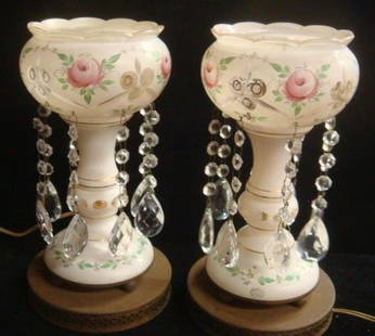 Pair of Electrified Rose Motif Lusters: White Painted: Pair of Electrified Rose Motif Lusters: White Painted Glass Lusters with Hand Painted Floral and Cut to Clear Design are 12"T With Pierced Metal Base. Each with Eight Teardrop Prisms. Foil Tag with