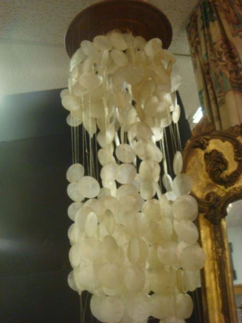 White Capize Shell Curtain Mobile: Circular Frame: White Capize Shell Curtain Mobile: Circular Frame Supports Several Garlands of Drilled Shells on Translucent Line. Tower is 64"L. Semi- Transparent White Shell from Windowpane Oyster, Found in Philipp