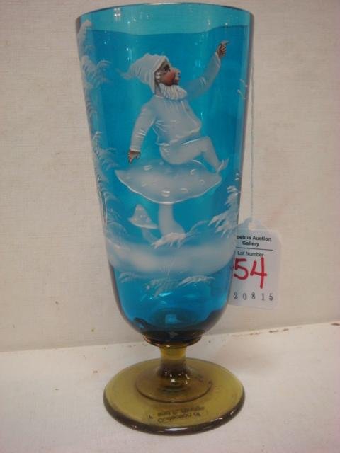 MARY GREGORY Prussian Blue Goblet with Amber Foot:: MARY GREGORY Prussian Blue Goblet with Amber Foot: Unusual Decoration of Gnome on Side. 6 3/4"T. (100-200)