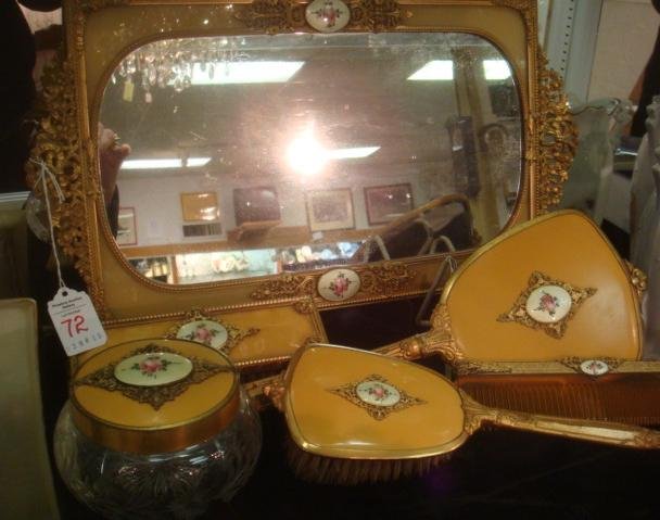 7 Piece Celluloid Dresser Set Ca 1930's: Gilt Cast: 7 Piece Celluloid Dresser Set Ca 1930's: Gilt Cast Metal Surrounds Celluloid w/Enameled Rose Accents on 16 3/4"L X 9"W Rectangular Mirror; 13"L Hand Held Mirror; 3 1/2"Dia. Cut Glass Powder Box; 7 1/2