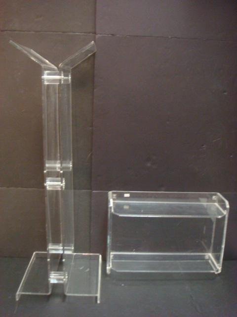 Three Lucite Mid Century Decorator Items: 2 Tiered Wall: Three Lucite Mid Century Decorator Items: 2 Tiered Wall Shelf is 12 1/2"T X 18"W X 6"D. Bed Tray with Book Holder and Hand Holds is 23"W X 8 1/2"T X 12"D. Floor Model Book Stand on Square Base is 33 1