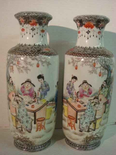 Pair of Hand Painted Chinese Vases: Quianlong Nian Zhi,: Pair of Hand Painted Chinese Vases: Quianlong Nian Zhi, Mid 20th C. Mark. Depiction of Scholars and Ladies at Table. Painted with Vivid Colors. Both 13"T. (100-200)