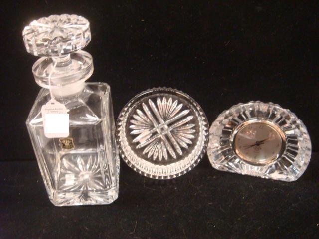 WATERFORD Coaster, E&R Decanter and LENOX Clock:: WATERFORD Coaster, E&R Decanter and LENOX Clock: Waterford Champagne Coaster is 5"D, 1 1/2"T. E&R W German Lead Crystal Decanter with Stopper is 10"T. Lenox Quartz Shelf Clock is 4"T. (100-200)