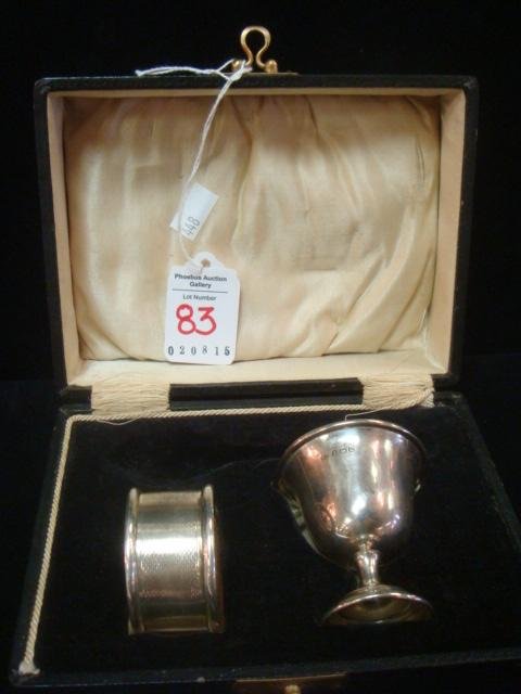 English Sterling Christening Egg Cup & Napkin Ring:: English Sterling Christening Egg Cup & Napkin Ring: In Original Satin and Velvet Lined Case. Egg Cup has Gold Wash Interior. 1 3/4"T. Fish Scale Pattern Napkin Ring is 1 3/4"D. Both with Birmingham An