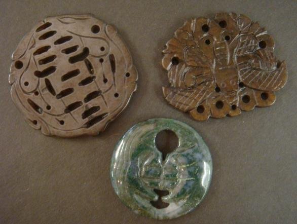 Hand Carved Jade Inro Pendants:: Hand Carved Jade Inro Pendants: Spinach Green Jade Pendant is 1 5/8"D. Pierced Brown Jade Pendant is 2"D with Some Green Showing Through. Dark Brown Jade Pierced and Carved Pendant is 1 3/4" X 2 1/8".