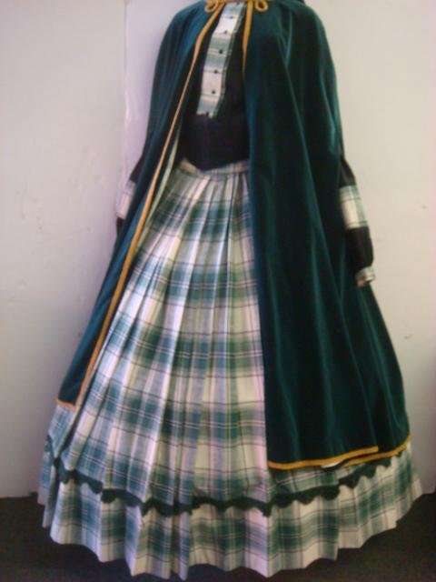 Civil War Re-Enactor's Mary Todd Lincoln Costume:: Civil War Re-Enactor's Mary Todd Lincoln Costume: Includes Hooded Green velvet Cape with Braid Trim, Plaid Skirt with Hoop. Black Blouse with Plaid Trim. Cotton Bloomers. (100-200)