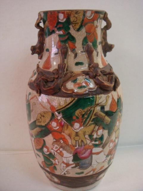 Vintage Japanese Satsuma Ovoid Form Earthenware Vase:: Vintage Japanese Satsuma Ovoid Form Earthenware Vase: Depicting War Scenes in Vivid Green, Orange & Rose on Mottled Tan Ground. Applied Animal Figures on Neck & Shoulder, Animal Form Handles w/Wooden