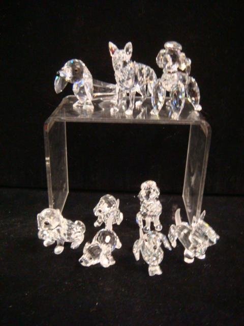 Nine SWAROVSKI Crystal Dogs:: Nine SWAROVSKI Crystal Dogs: Includes 2 1/4"T German Shepard, 2 1/4"T Standing Poodle, 1 7/8"T Sitting Poodle, 1 1/2"T St Bernard with Keg, 1 5/8"T Scottie, 3"L Large Dachshund with Spring Tail, 2 1/8