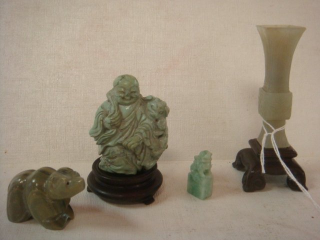 Four Carved Green Jade and Stone Figurines:: Four Carved Green Jade and Stone Figurines: Small Green Jade Vase on Wood Stand is 3 1/2"T. Green Jade Diminutive Carved Foo Dog Stands 1 1/6"T. Green Stone Carved Bear Stands 1 1/8"T and the Finely C
