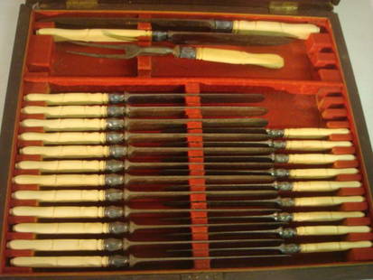 J RUSSELL & CO Green River Works Carving Set, Knives:: J RUSSELL & CO Green River Works Carving Set, Knives: Carved Handles of Unknown Substance. 3 Piece Carving Set with Fork and 12 1/4" and 13 7/8"L Carving Knives. Twenty One 10 1/2"L Table Knives.