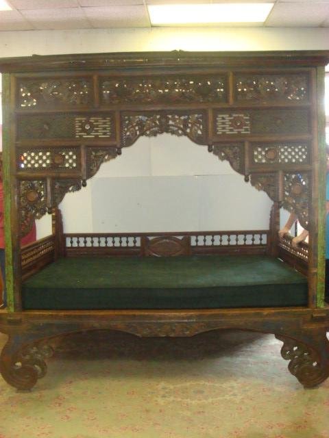 Heavily Carved Antique Javanese Wedding "Opium" Bed:: Heavily Carved Antique Javanese Wedding "Opium" Bed: Open Canopy on 4 Poster Frame, Flat Cornice Over Heavily Carved Paneled Front with Flower and Scrolls Arching Over Bed with Spindled Gallery on Sid