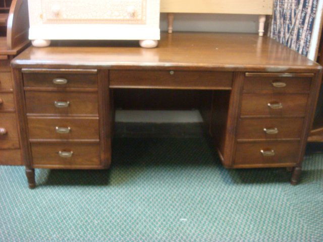 Double Pedestal Walnut Executive Desk:: Double Pedestal Walnut Executive Desk: 3 Inch Banded Top Over Fitted Center Drawer, Pedestals Fitted with 4 & 3 Drawers(one Double), with Slide Out Writing Surfaces on Each Side, Set On Turn Wood Legs
