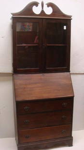 Basic Early 20th C. Walnut Secretary/Bookcase:: Basic Early 20th C. Walnut Secretary/Bookcase: Scroll Arched Pediment with Center Finial over Double Glazed Cabinet Doors. Single Interior Wooden Shelf. Slant Front with Open Cubby Interior. 3