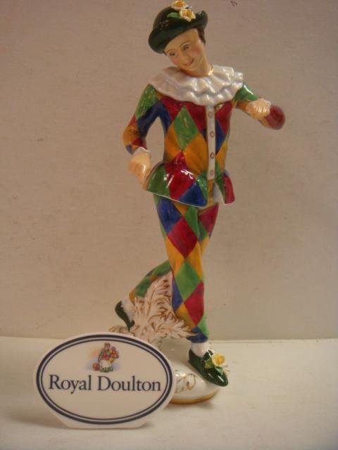 ROYAL DOULTON Harlequin Figurine and Plaque:: ROYAL DOULTON Harlequin Figurine and Plaque: HN 2737, Modelled by Douglas Tootle Under Direction of Eric Griffiths, Head of Ceramic Sculpture. Dated 1982. 12 1/4". Multicolor Hand painted with Applied