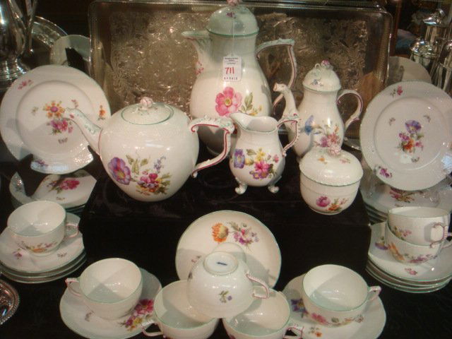 KPM Handpainted Porcelain Coffee/Tea Service, 33Pc:: KPM Handpainted Porcelain Coffee/Tea Service, 33Pc: All with Blue Underglaze Berlin Sceptre Mark, Ca 1950's. Handpaintd Florals and Butterflies, Green Rims and Embossed Basketweave Edges. Chocolate Po