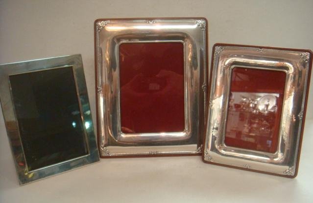 Three Sterling Silver Frames:: Three Sterling Silver Frames: Reed and Barton Frame is 6 1/8" X 8 1/8" with 4 1/2" X 6 1/2" Opening. Two Valori Frames, One 6 3/4" X 8 34" with 3 5/8" X 5 1/2" Opening and 10 1/2" X 8 1/2" with 5" X 7