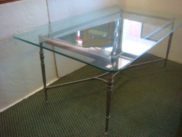 Metal Base Glass Top Dining Table:: Metal Base Glass Top Dining Table: Gray Metal Base with Turned Legs and Curved Stretcher. Polished Beveled Edge. 43"W X 6'3"L X 29"T. (200-400)