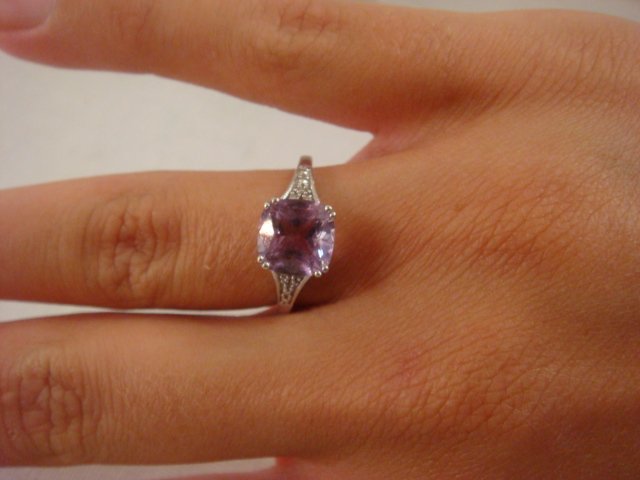 14KT White Gold Lilac SPINEL Ring:: 14KT White Gold Lilac SPINEL Ring: Size 7, Square Cut Stone Set in Corner Prongs with Three Diamond Chips on Each Side in Open Fan Filigree Setting. (200-300)