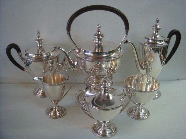 TUTTLE SILVERSMITHS Seven Piece Sterling Tea Set:: TUTTLE SILVERSMITHS Seven Piece Sterling Tea Set: Boston Company 1890-Present. Includes 10 1/2"T Coffee Pot, 9"T Tea Pot, 12"T Kettle on Stand with Burner (All With Ebony Handles), 6 1/2"T Lidded Suga