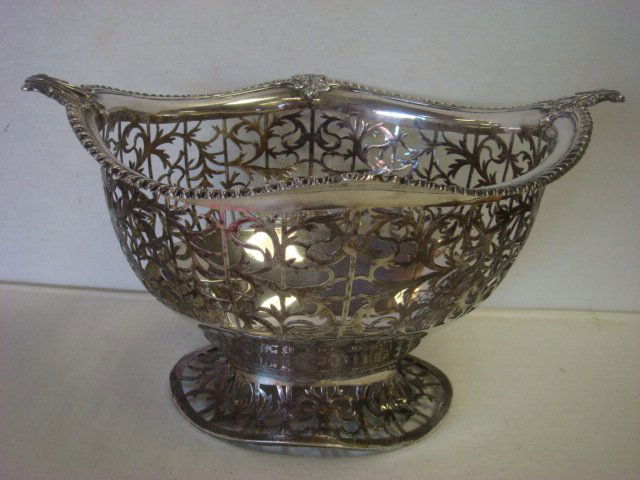 19th C. English Sterling Silver Footed Basket:: 19th C. English Sterling Silver Footed Basket: English Hallmarks, Lion Passant, London Date Mark of 1889 and Queen Victoria Duty Mark. Makers Mark WW Over RT in Shield. Open Work Sides and Foot. Side