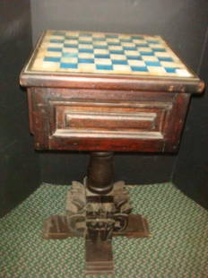 Hand Carved Wooden Mexican Chess Table:: Hand Carved Wooden Mexican Chess Table: Turned Pedestal Chess Table with Geometric Carved Base on 4 Way Foot. Single Drawer. Inset Onyx and Alabaster Board. Carved Onyx and Alabaster Playing Pieces.