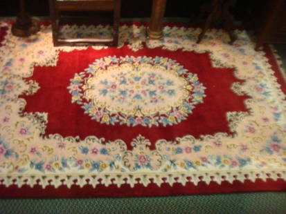 Persian Handwoven Wool Rug:: Persian Handwoven Wool Rug: Oval Center Medallion of Soft Pastel Florals on Cream. Deep Border Repeats the Center Flowers. Burgundy Ground. Cotton Knotted Fringe. 6' X 8'1" (300-400)