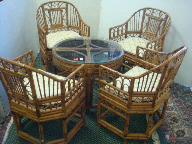 Rattan and Bamboo Glass Topped Table & Four Chairs:: Rattan and Bamboo Glass Topped Table & Four Chairs: Round Rattan Table has Glass Top. 23"T, 24 3/4"D. Four Rounded Back Bamboo Chairs have Cane Seats and Cloth Cushions. (200-400)