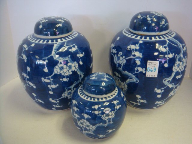 Three Blue and White Asian Ginger Jars:: Three Blue and White Asian Ginger Jars: Two Large and 1 Small Ginger Jars With Lids in Ming Tree Pattern. Double Circle Mark on Bottoms. Large Ones Are 9 1/2"T. One has Repaired Lid and Glued to Jar. 