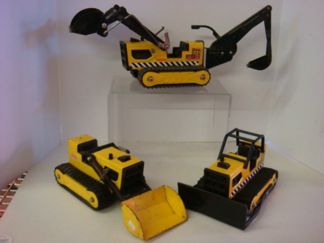 Three Vintage Tonka Steel Construction Vehicles:: Three Vintage Tonka Steel Construction Vehicles: Includes Backhoe, Front End Loader T-6 and Bull Dozer. In Played With Condition. (50-100)