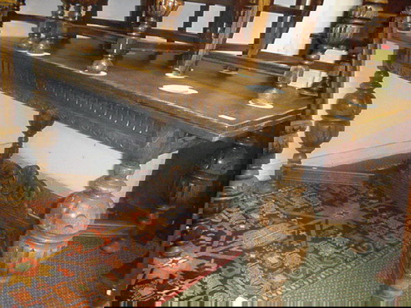 Gothic Influence Carved Oak Dining Table: Gothic Influence Carved Oak Dining Table: 46" X 56"L X 30"T. 2 Pull Out Extension Leaves Large Reeded Ball Legs. Buyers are reminded that items are of considerable age and exhibit fair wear and tear.