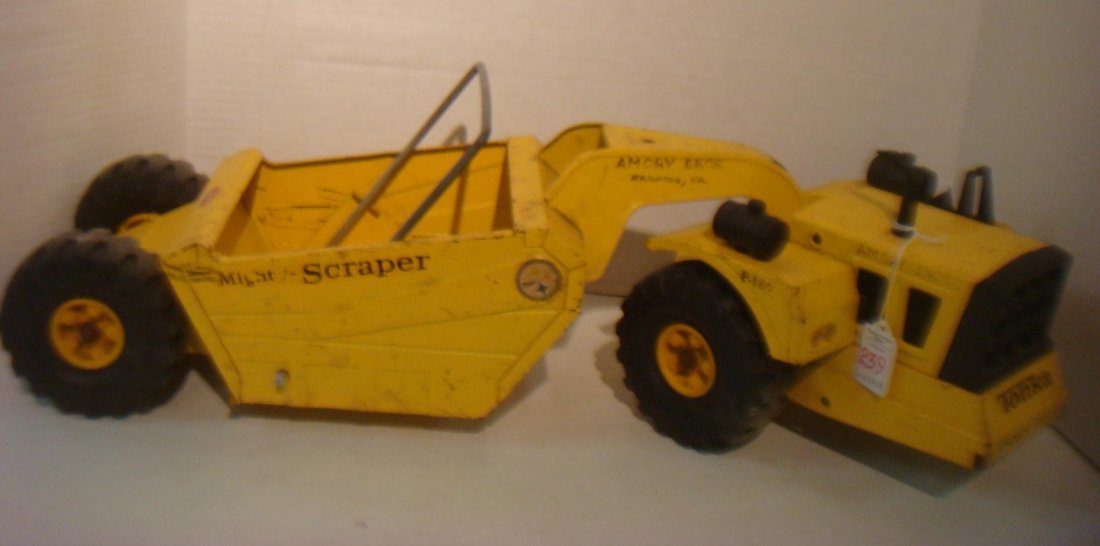 TONKA Mighty-Scraper Road Construction Truck:: TONKA Mighty-Scraper Road Construction Truck: Two Piece Pressed Metal Truck with Plastic Tires. Made in USA. 28"L. Played with Condition. (100-200)