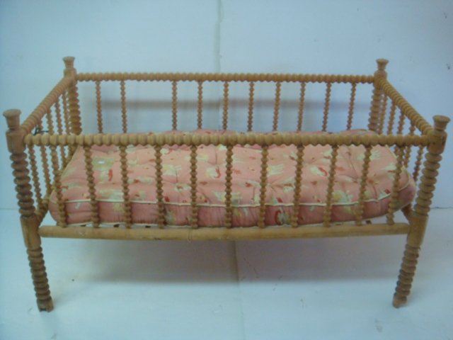 Vintage Spool Turned Wooden Toddler Bed:: Vintage Spool Turned Wooden Toddler Bed: Jenny Lind Spindle Spool Bed Dowels Support Mattress. 27"T X 50"L X 25 1/2"W. Casters Removed, Bed Has Been Refinished. (100-200)