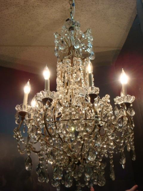 Eight Light Crystal Chandelier:: Eight Light Crystal Chandelier: Curled Arms with Glass Beads Separated by Crystal Swags with Tear Drop Prisms and Ball Drop Finial. Crystal Bobeches with Tear Drop Prisms. 36"L, 27"D. (300-500)