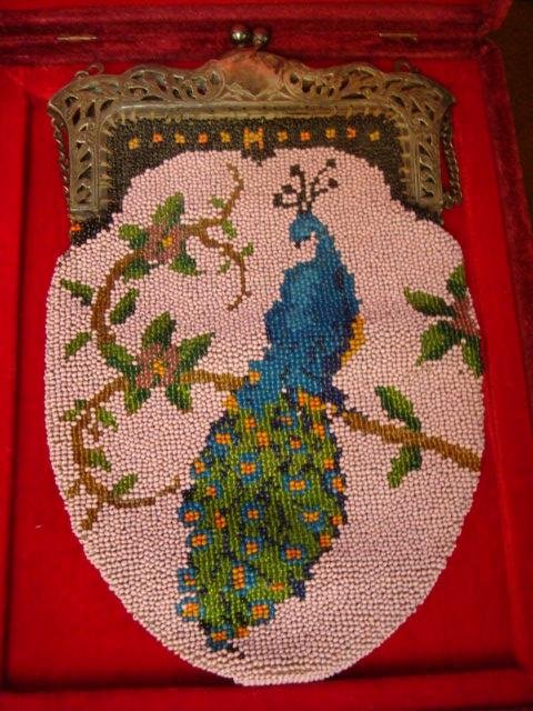 Double Beaded Peacock Purse in Case:: Double Beaded Peacock Purse in Case: Satin Lined with Subtle Etched Silvered Frame, Link Chain Handle, Ball Kiss Closure. Full Figured Peacock on Branch on Both Sides on Lavender Background, All Seed 