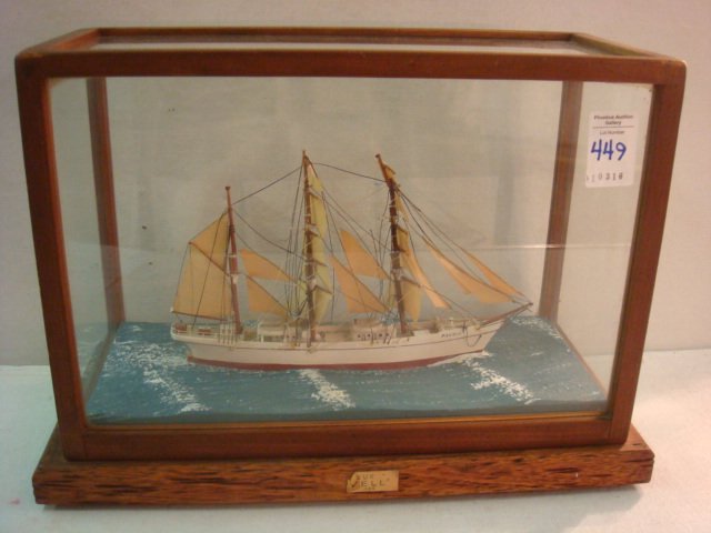 Ship Model of Barque Favell Scale .003, CA 1935:: Ship Model of Barque Favell Scale .003, CA 1935: Model is Depicted Before the Wind on Flowing Gray Sea in Glass Case with Wood Base 9 1/2" x 13 1/4" x 6". Favell was Built in Bristol England in 1895 a