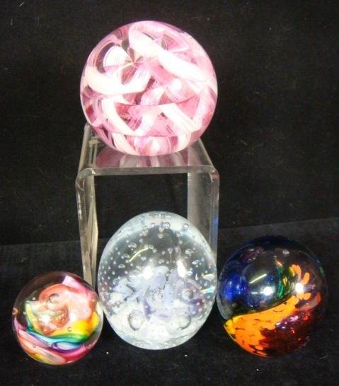 Four SIGNEL Studios Glass Paperweights:: Four SIGNEL Studios Glass Paperweights: Jim Karg Multicolored Swirl, 3"T. Wheaton Village Pink and White Ribbon, 3 1/4"T. Gibson 1998 Controlled Bubble and Flower, 3 1/4"T. Marilyn '97 Multicolored, 2