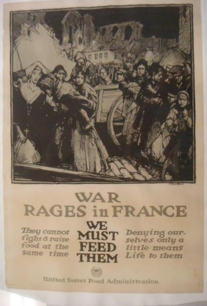Original World War I Poster, "WAR RAGES IN FRANCE":: Original World War I Poster, "WAR RAGES IN FRANCE": By Townsend, "We Must Feed Them" Striking Image of War Refugees. United States Food Administration, No 19. 29 5/8" x 20 1/8". Slight Water stain. Co