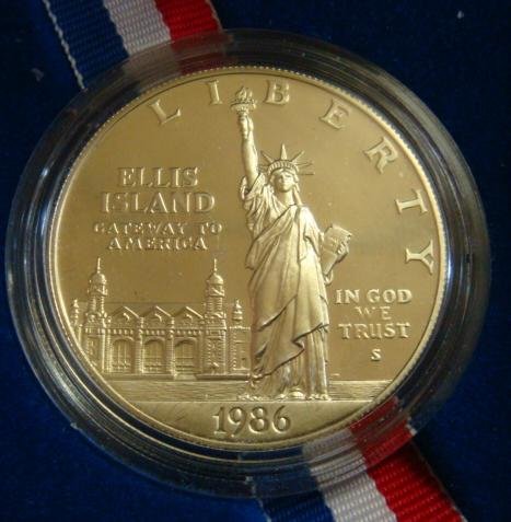 1986S PROOF STATUE LIBERTY CENTENNIAL SILVER DOLLAR:: 1986S PROOF STATUE LIBERTY CENTENNIAL SILVER DOLLAR: PF-67 Coin in Presentation Box with Certificate of Authenticity. "Give Me Your Tired, Your Poor, Your Huddled Masses Yearning to Breath Free." Bill