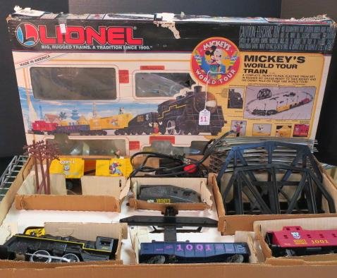 LIONEL O Gauge "Mickey's World Tour Train" Set:: LIONEL O Gauge "Mickey's World Tour Train" Set: 1991 Electric Set Includes Steam Engine, Tender, Operating Car, Gondola s, Caboose, 8 Curved/6 Straight Tracks, DC Transformer, Bridge, Road Signs, Tele