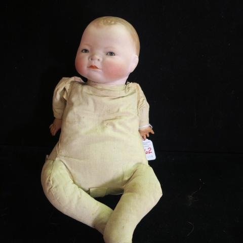 GRACE PUTNAM Bisque Head Bye-Lo Baby Doll:: GRACE PUTNAM Bisque Head Bye-Lo Baby Doll: Molded Bisque Head, Set Glass Eyes, Marked on Neck. No Cracks in Head. Cloth Body, Plastic Hands. 14"L in Frog Position. Paint Scratches on Face, Small Tear 