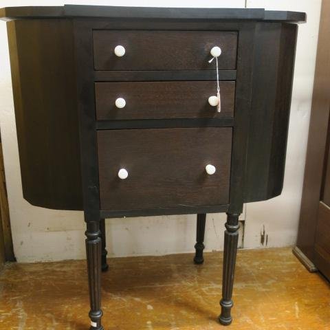 Mahogany Martha Washington Sewing Cabinet:: Mahogany Martha Washington Sewing Cabinet: Three Center Drawers Flanked by Hexagonal Material Compartments on Each Side. Covered by Shaped Lids with Concealed Hinges. Stands on Reeded, Tapered Legs. 2
