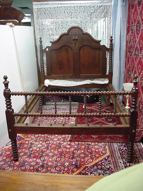 341, Walnut Victorian Rope Bed: Spool Turned Foot Board: 341, Walnut Victorian Rope Bed: Spool Turned Foot Board Rails and Side Headboard Rails. Solid Back with Inset Panels and Applied Carving at Center of Sculpted Crest. Buyers are reminded that items are