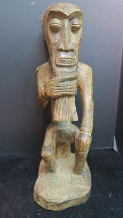 CHOKWE Tribe, Congo, Seated Chief Statue CA 1890:: CHOKWE Tribe, Congo, Seated Chief Statue CA 1890: We Find our "Heart Of Darkness" Congo Chief in a Contemplative Mood Stroking his Jutting Beard. 21" tall. African Art Collection of Nick Beskenis. (30