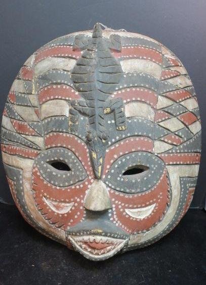 BALUBA Tribe, Zaire, Victory Celebration Mask: CA 1950:: BALUBA Tribe, Zaire, Victory Celebration Mask: CA 1950: Multicolored Face Mask with Crocodile Forehead Piece, Featuring Grey, White and Red Dyes Intermixed with Scarification Tattoos. Mask Represents