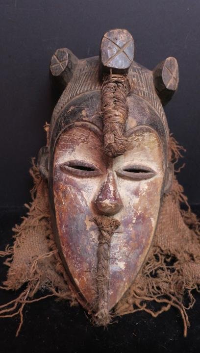 LULUA Tribe, Congo, Ceremonial Mask, CA 1910:: LULUA Tribe, Congo, Ceremonial Mask, CA 1910: White Face Mask with Helmet and Three Part Crest. Hemp and Burlap Decorations. Moon Shaped Concave Face. Used at Funerals and Circumcisions. 16" x 10". Af