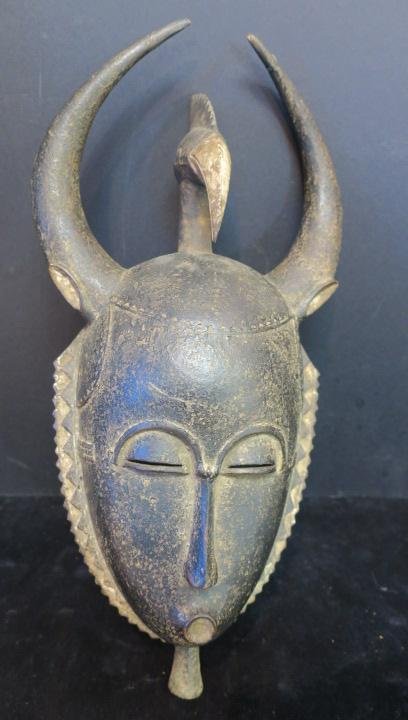 African Tribal Mask, Cattle, Egret Spirit Mask:: African Tribal Mask, Cattle, Egret Spirit Mask: African Traditions have Animal/ Human Features Dance mask is Hollowed Oval with Linear Nose, Pierced Slit Eyes, Framed by Carved Appendage. 17" Tall. Af