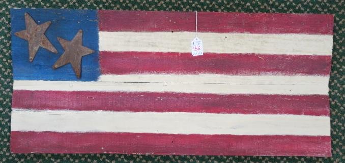 DONALD LEVINER, Folk Art American Flag on Board:: DONALD LEVINER, Folk Art American Flag on Board: Wooden Flag has 2 Metal Stars and 7 Stripes. Hand painted Patriotic Aged Piece Made from Reclaimed Wood. 31 1/2" X 14". (100-200)