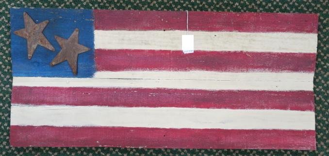 DONALD LEVINER, Folk Art American Flag on Board:: DONALD LEVINER, Folk Art American Flag on Board: Wooden Flag has 2 Metal Stars and 7 Stripes. Hand painted Patriotic Aged Piece Made from Reclaimed Wood. 31 1/2" X 14". (100-200)